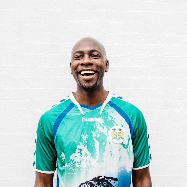 Asha Raman, Lead Design Curator at Lumenora Cryptonica, reviewing corporate floral arrangements